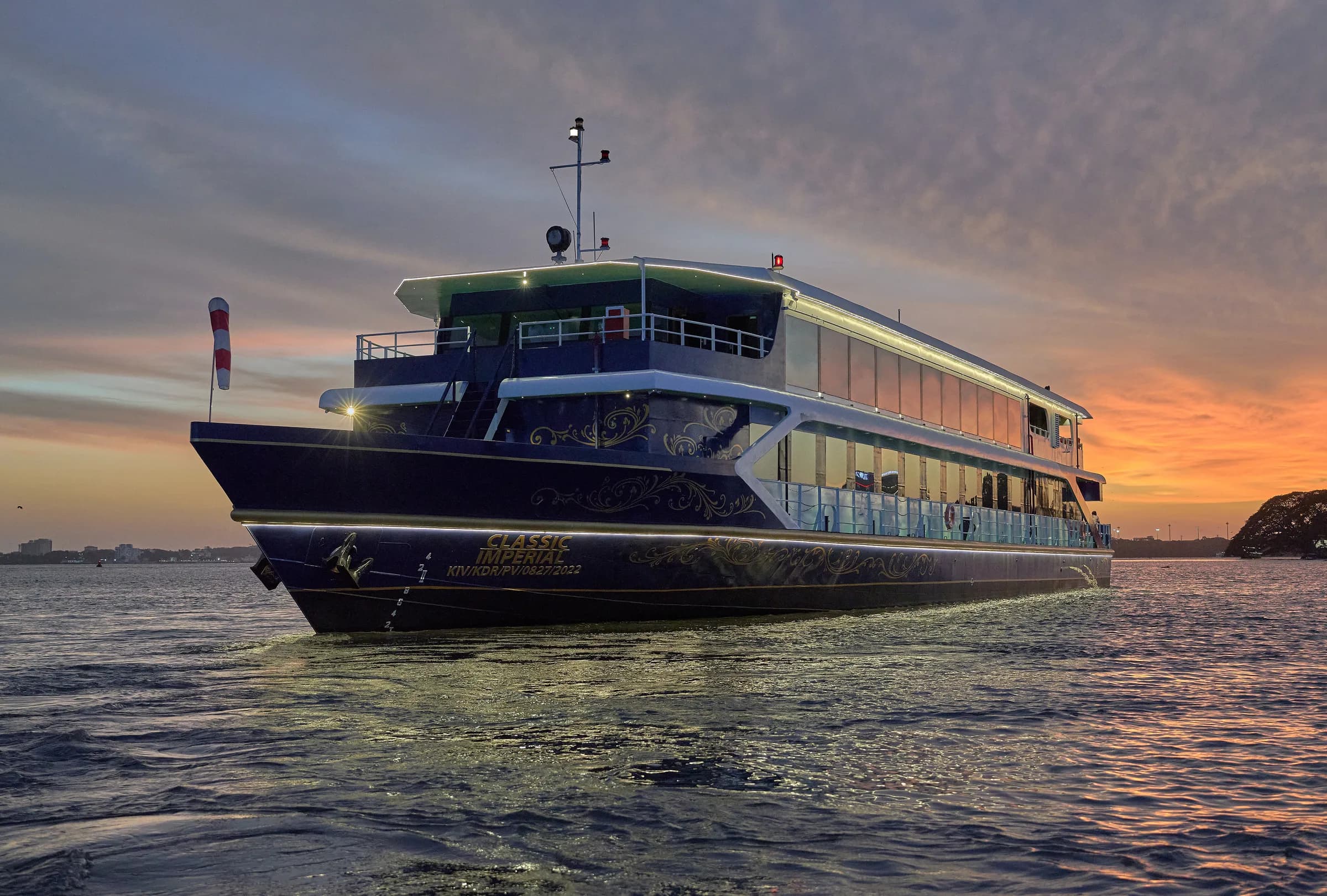 Classic Imperial illuminated on the water at dusk
