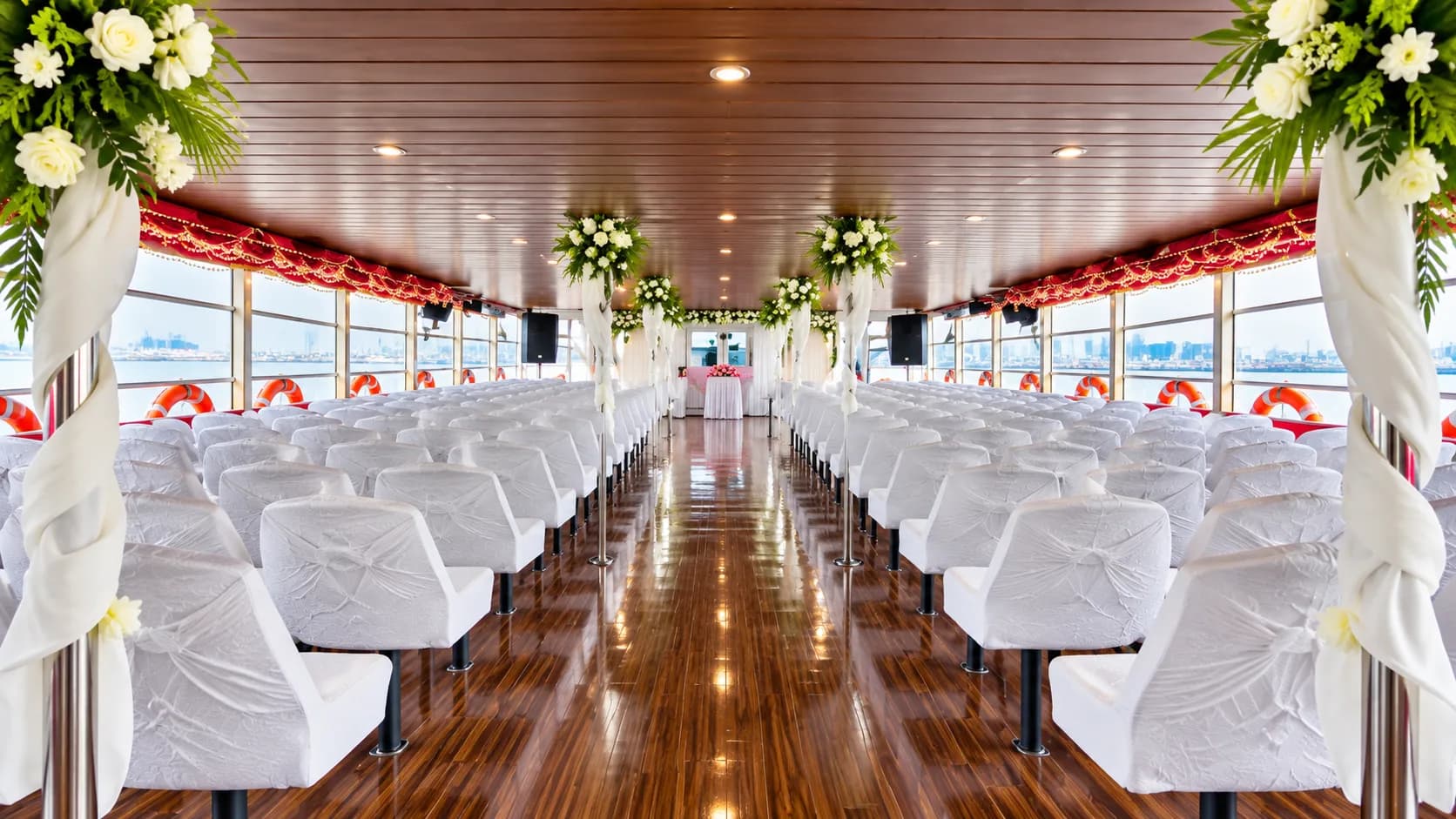 Event seating with a floral aisle aboard Classic Paradise