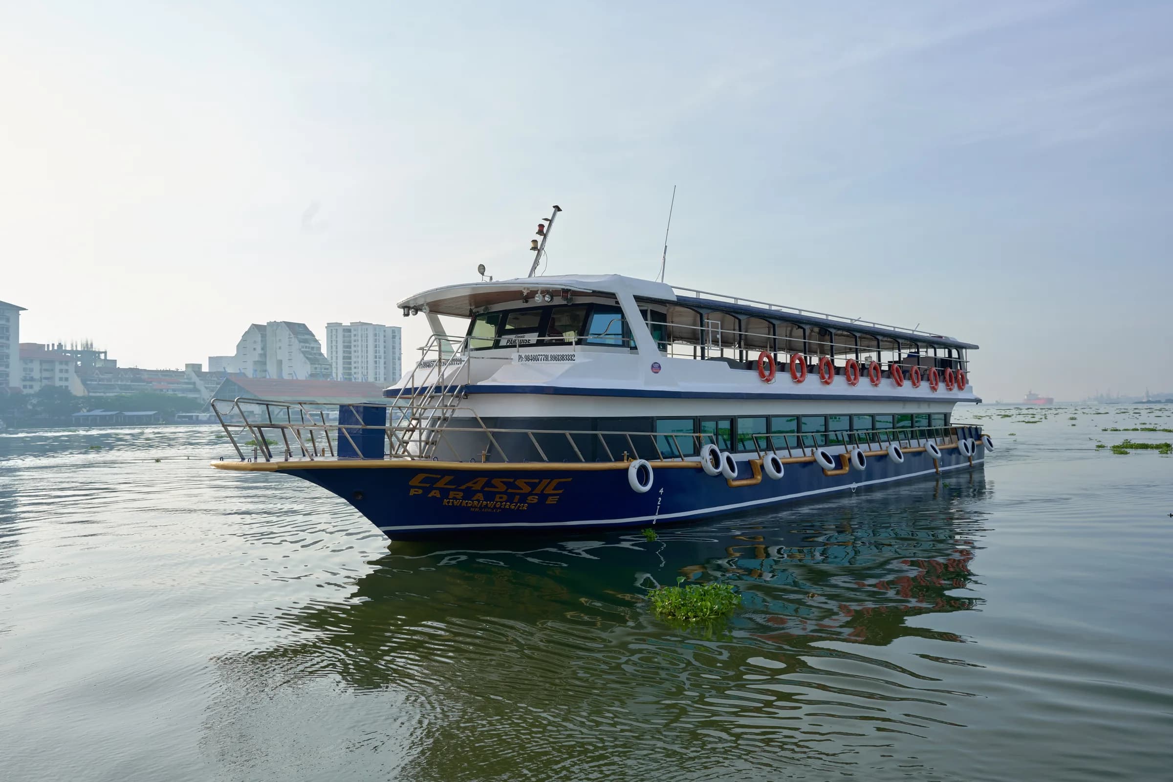 Vessel cruising on calm Kochi backwaters